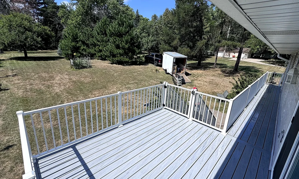 Composite decking and railing detail from a Home Improvement Partners project in Maplewood, Minnesota